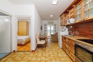 Apartment (A2) | Private kitchen | Fridge, microwave, oven, stovetop - Apartments Zorka (Rab)