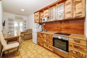 Apartment (A2) | Private kitchen | Fridge, microwave, oven, stovetop - Apartments Zorka (Rab)