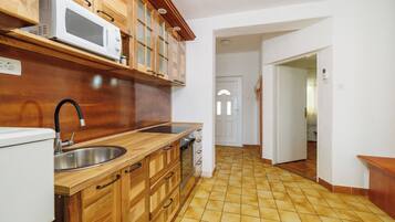 Apartment (A2) | Private kitchen | Fridge, microwave, oven, stovetop
