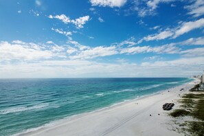 A beach with clear blue water and a sandy shore. - 11th floor paradise! (Panama City Beach)