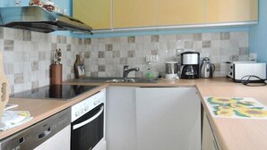Espresso maker, coffee/tea maker, fridge, microwave