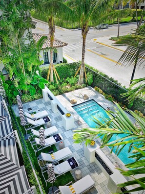 Outdoor pool, open 9:00 AM to 6:00 PM, pool umbrellas, pool loungers