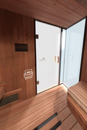 A modern room with wooden paneling, a sliding glass door, and a bed.