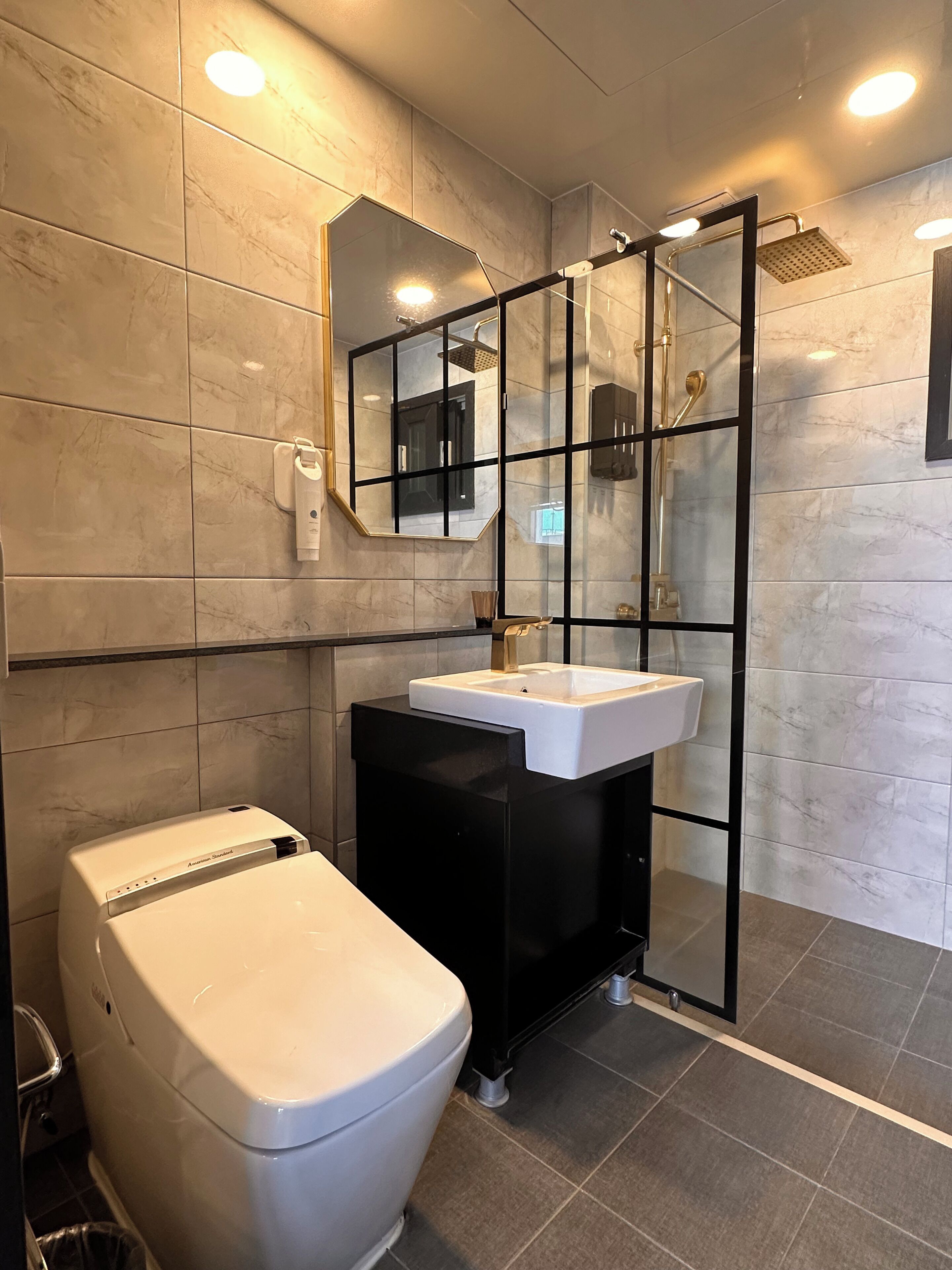 family suite | bathroom | shower, hair dryer, slippers, bidet