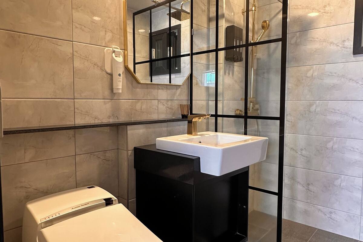 family suite | bathroom | shower, hair dryer, slippers, bidet