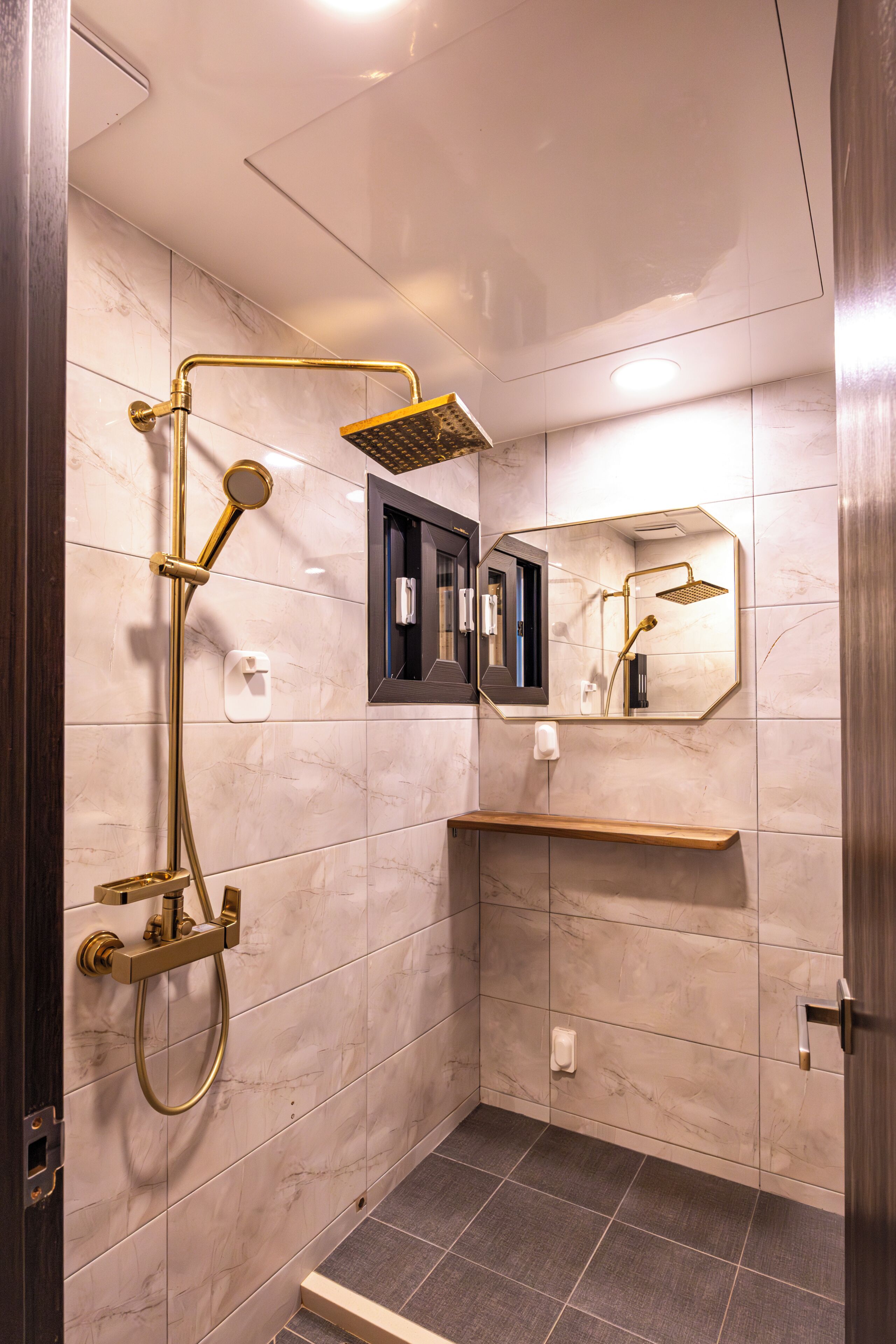 deluxe family twin | bathroom | shower, hair dryer, slippers, bidet