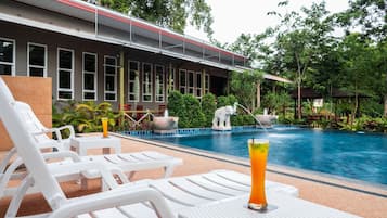 Outdoor pool, open 7:00 AM to 9:00 AM, pool umbrellas