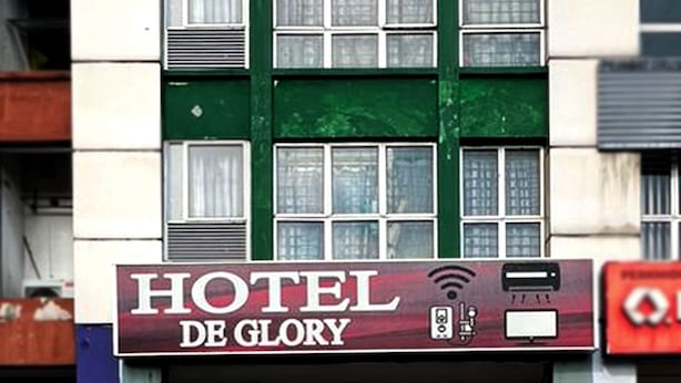 A building with a sign that reads "HOTEL DE GLORY" and "Care For Your Health". - De Glory Hotel USJ 21 (Subang Jaya)