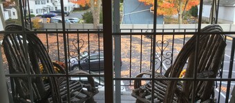 Downtown Westborough one bedroom condo with treetop views and private parking