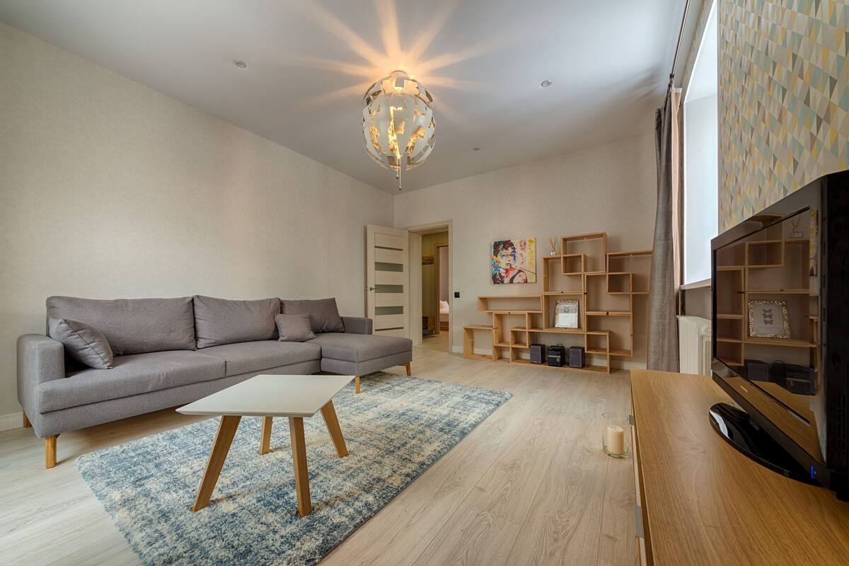 Deluxe Apartment | Living area | 100-cm flat-screen TV with digital channels, TV