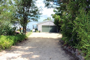 The house entrance. 5+ car parking spaces available in front yard/driveway.