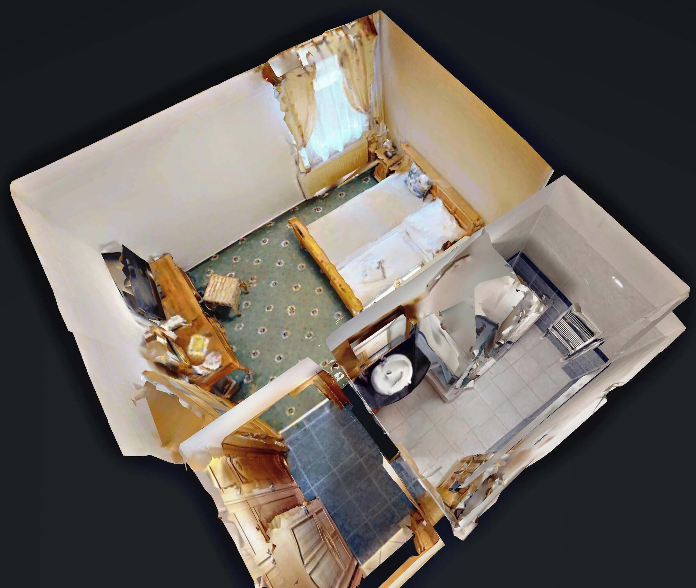 Une pièce avec un lit, une petite table et une fenêtre.