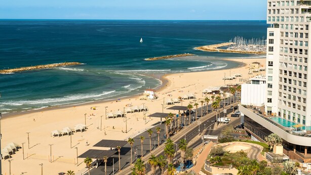 A coastal hotel with a beach view, a swimming pool, and a parking area. - Full Sea View on The Beach With Balcony (Tel Aviv)