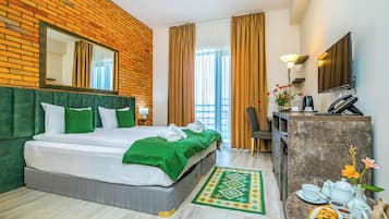 Colchones Select Comfort, minibar y tabla de planchar con plancha