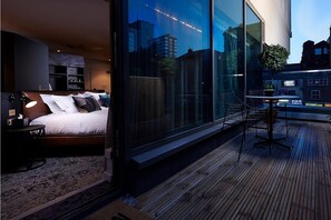 Suite, 1 King Bed (Furnished Balcony) | In-room safe, individually decorated, individually furnished, desk