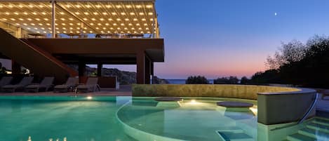 Indoor pool, 5 outdoor pools, open 10:30 AM to 6:30 PM, pool umbrellas