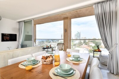 Modern Gem with Stunning Balcony by Sea N Rent
