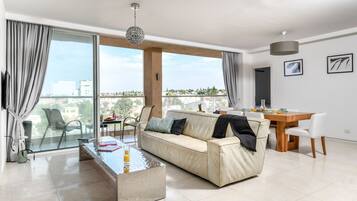 Apartment, 3 Bedrooms | Living area | Flat-screen TV