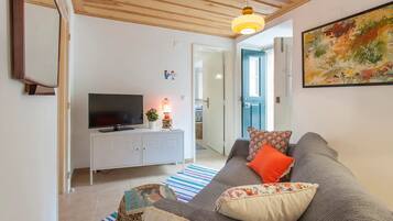 Apartment, 1 Bedroom | Living room | Flat-screen TV