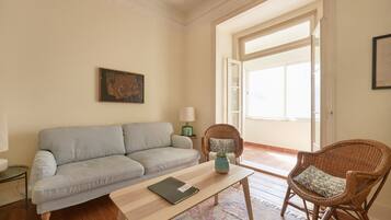 Apartment, 4 Bedrooms | Living room | Flat-screen TV