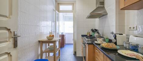 Apartment, 4 Bedrooms | Private kitchen | Full-size fridge, microwave, oven, stovetop