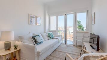 Apartamento, 1 quarto | Área de estar | TV de tela plana