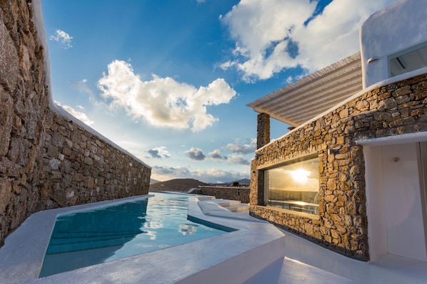 Outdoor pool, a heated pool, pool loungers