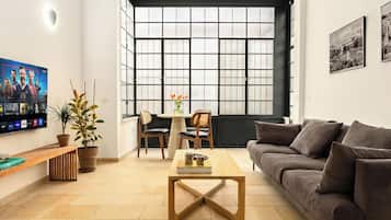 Departamento, 1 habitación | Área de sala de estar | Televisión