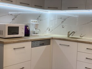 Fridge, microwave, stovetop, coffee/tea maker