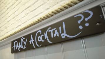 A sign with the text "Fancy A Cocktail?"
