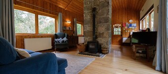 Secluded woodland cottage on the banks of a pristine Highland river