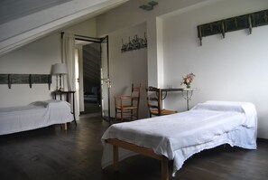 Twin Room, Shared Bathroom | Individually furnished, blackout drapes, bed sheets
