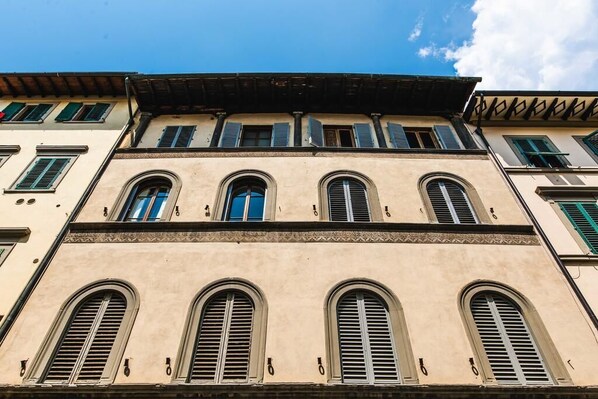 A building with multiple windows and a flat roof.