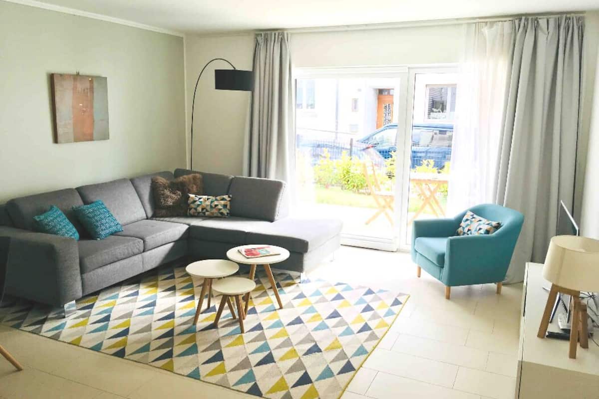 Apartment | Living area | 55-inch flat-screen TV with cable channels, TV, Netflix