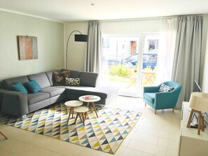 Apartment | Living area | 55-inch flat-screen TV with cable channels, TV, Netflix - Large Retro Chic Flat 100m2 in City Center - Parking (Luxembourg City)