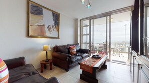 Classic Apartment | Living room | 32-inch flat-screen TV with cable channels, TV - Strand Beach Views (Cape Town)