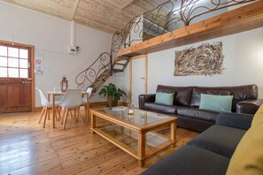 Comfort Apartment | Living area | 54-inch plasma TV with satellite channels, TV, Netflix - The Barn Strand (Cape Town)