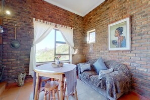 Deluxe Apartment | Living room | 32-inch plasma TV with cable channels, TV, fireplace