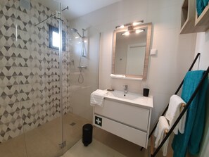 Shower, hair dryer, towels, soap