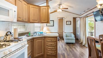 Fridge, cookware/dishes/utensils, dining tables