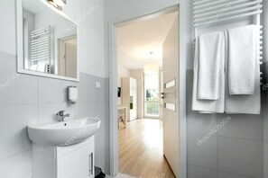 Shower, rainfall showerhead, towels, soap
