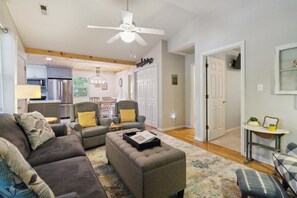 A living room with a sofa, armchairs, a coffee table, and a ceiling fan. - Welcome to “Relax Inn” Retreat at Lake Cumberland – A Perfect Cabin Escape (Burnside)