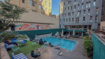 Seasonal outdoor pool, open 10:00 AM to 8:00 PM, pool loungers