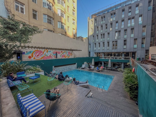 Seasonal outdoor pool, open 10:00 AM to 8:00 PM, pool loungers