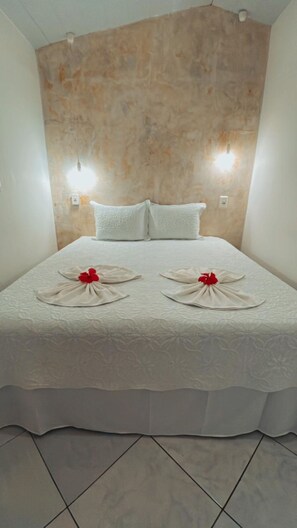 Quarto duplo standard | Frigobar, cortinas blackout, roupa de cama