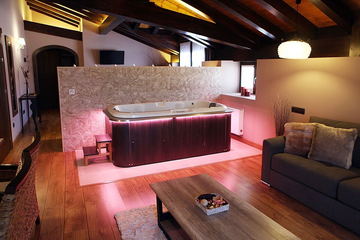 Suite, Jetted Tub | Living area | Flat-screen TV