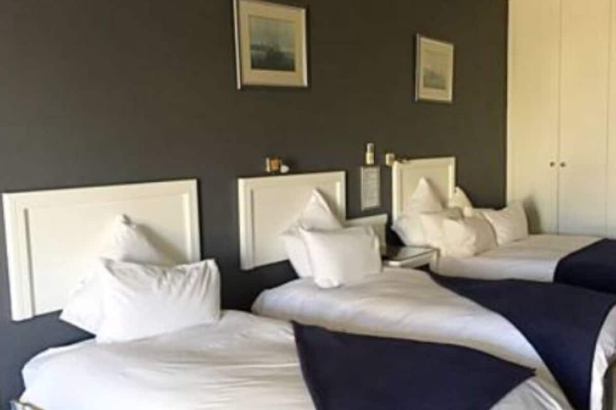 Standard Quadruple Room | Desk, blackout drapes, iron/ironing board (on request), WiFi (free)