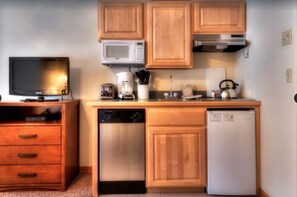 Fridge, stovetop, dishwasher, coffee/tea maker