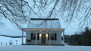 A white house with a porch, a front door, and a mailbox. - Twin Maple Cottage, a country cottage get away near Blacksburg - 3BR 1Bath (Dublin)
