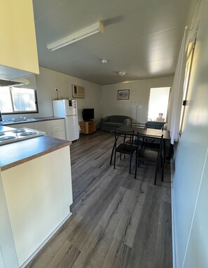 Deluxe House, 2 Bedrooms, Pets Not Allowed | Living area | Flat-screen TV, DVD player - Deniliquin Pioneer Tourist Park (Deniliquin)